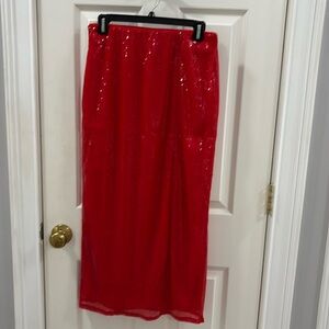 Sequined, red maxi with slit over knee.